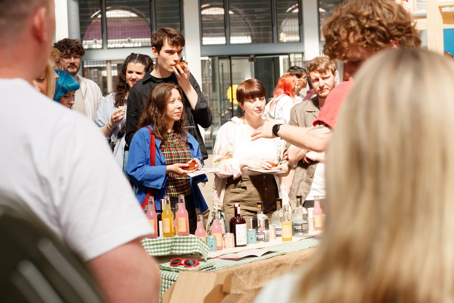 Guests tasting agave spirits from clay copitas at a previous Copita festival